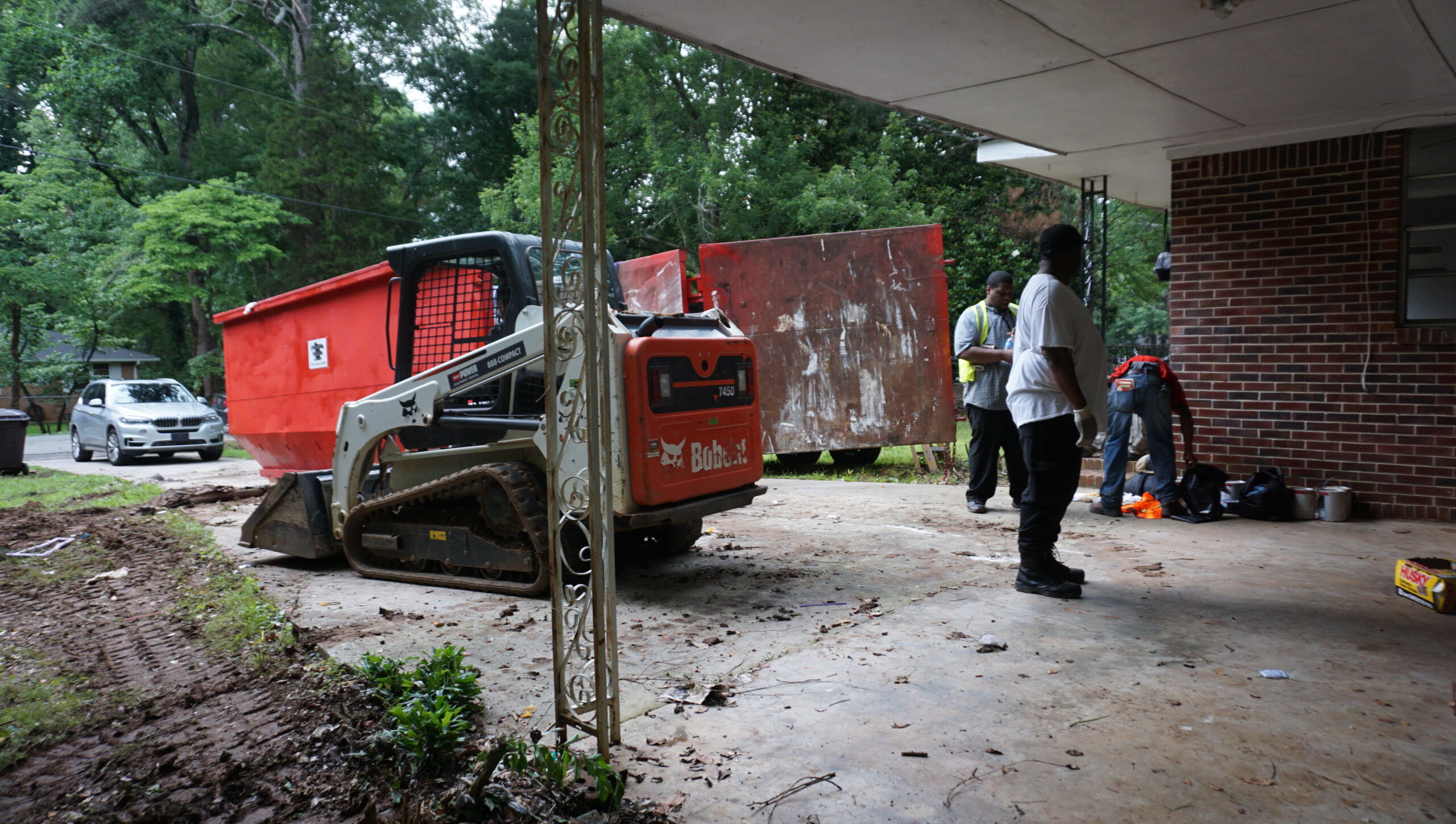 345 CARES demolition crew — Bobcat T450 compact track loader, residential demo Atlanta GA