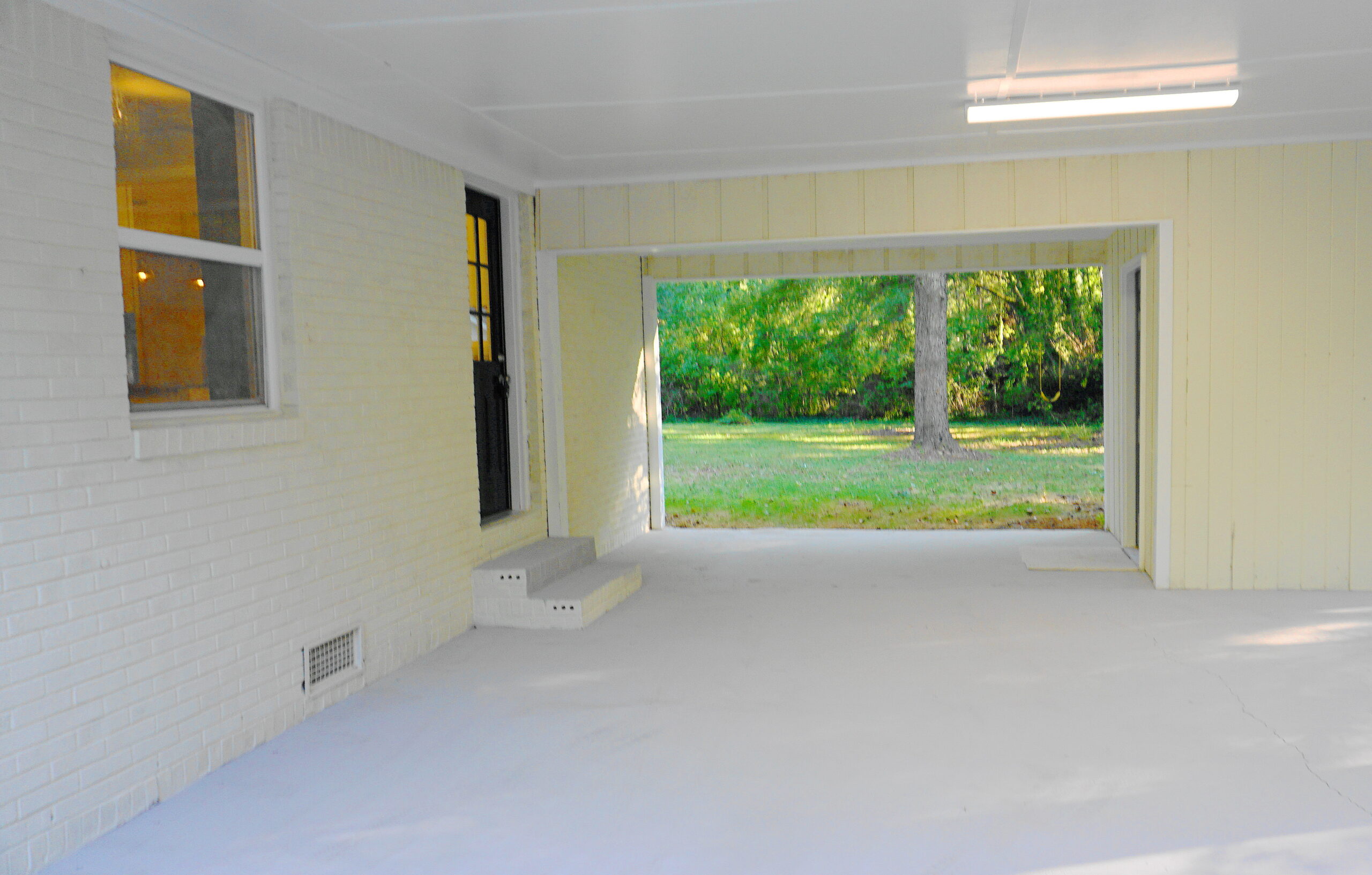 Workshop interior renovation Atlanta GA — clean floor, open garage space